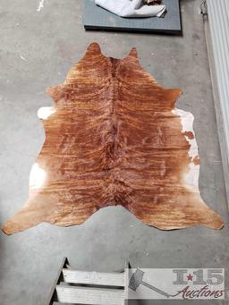 Large Brazilian Brindle hair on cowhide rug. Measures approximately 38-46 square feet.