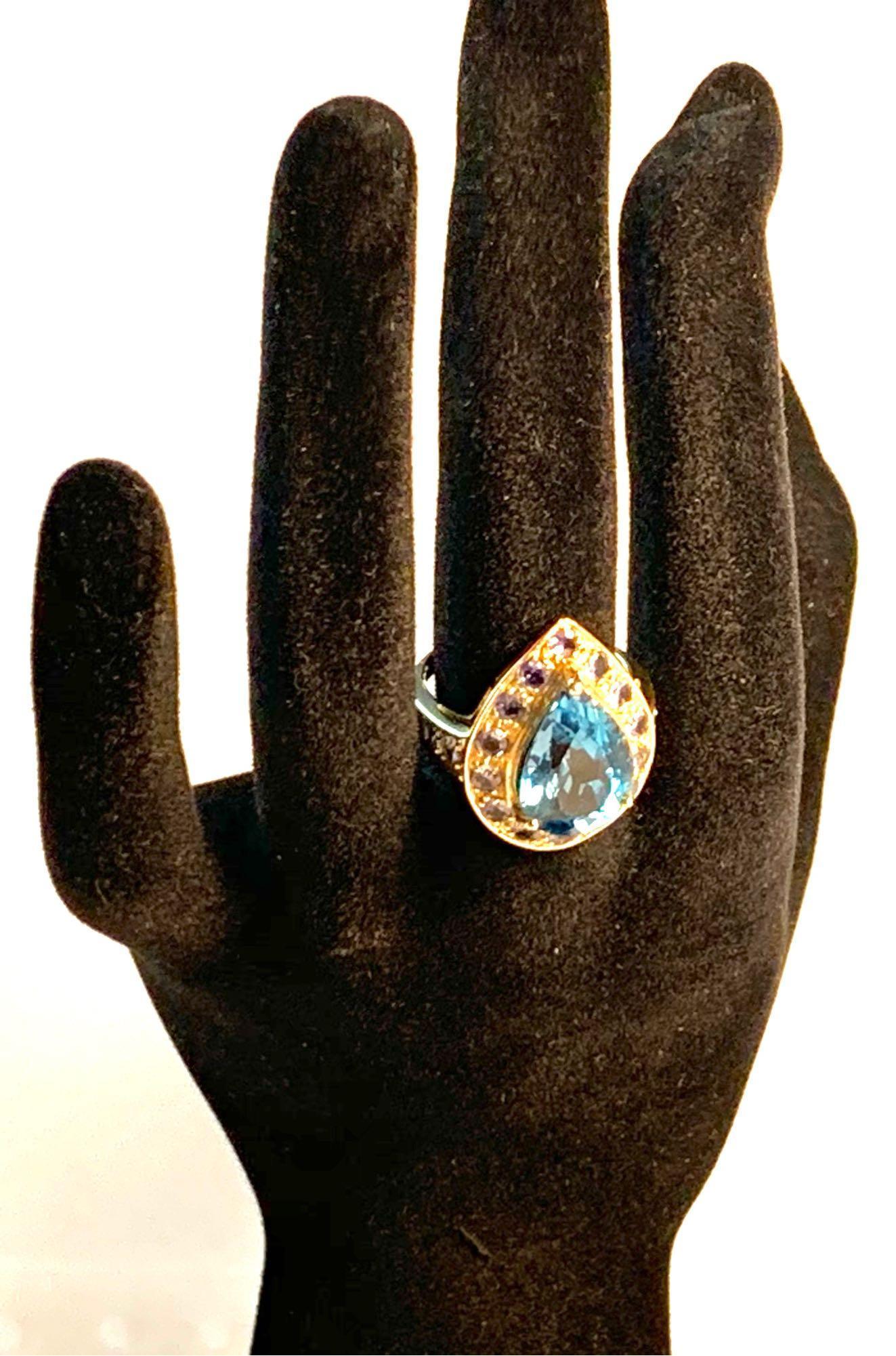 10kt yellow gold ring 6.50 CTW 5.50 blue topaz and 1.00 ct tanzanite