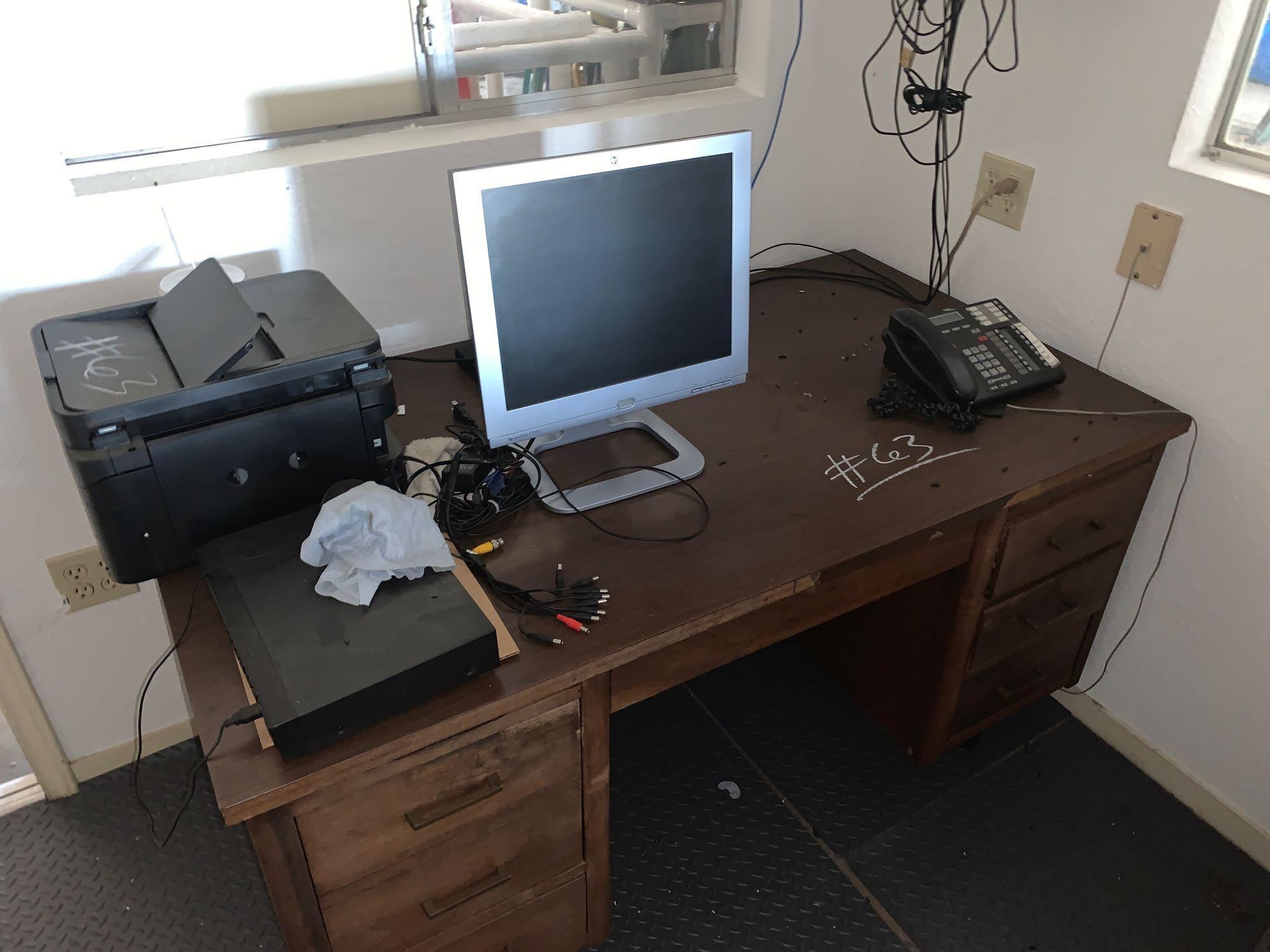 Office hard wood desk, shelf for files, fan, telephone, computer and printer