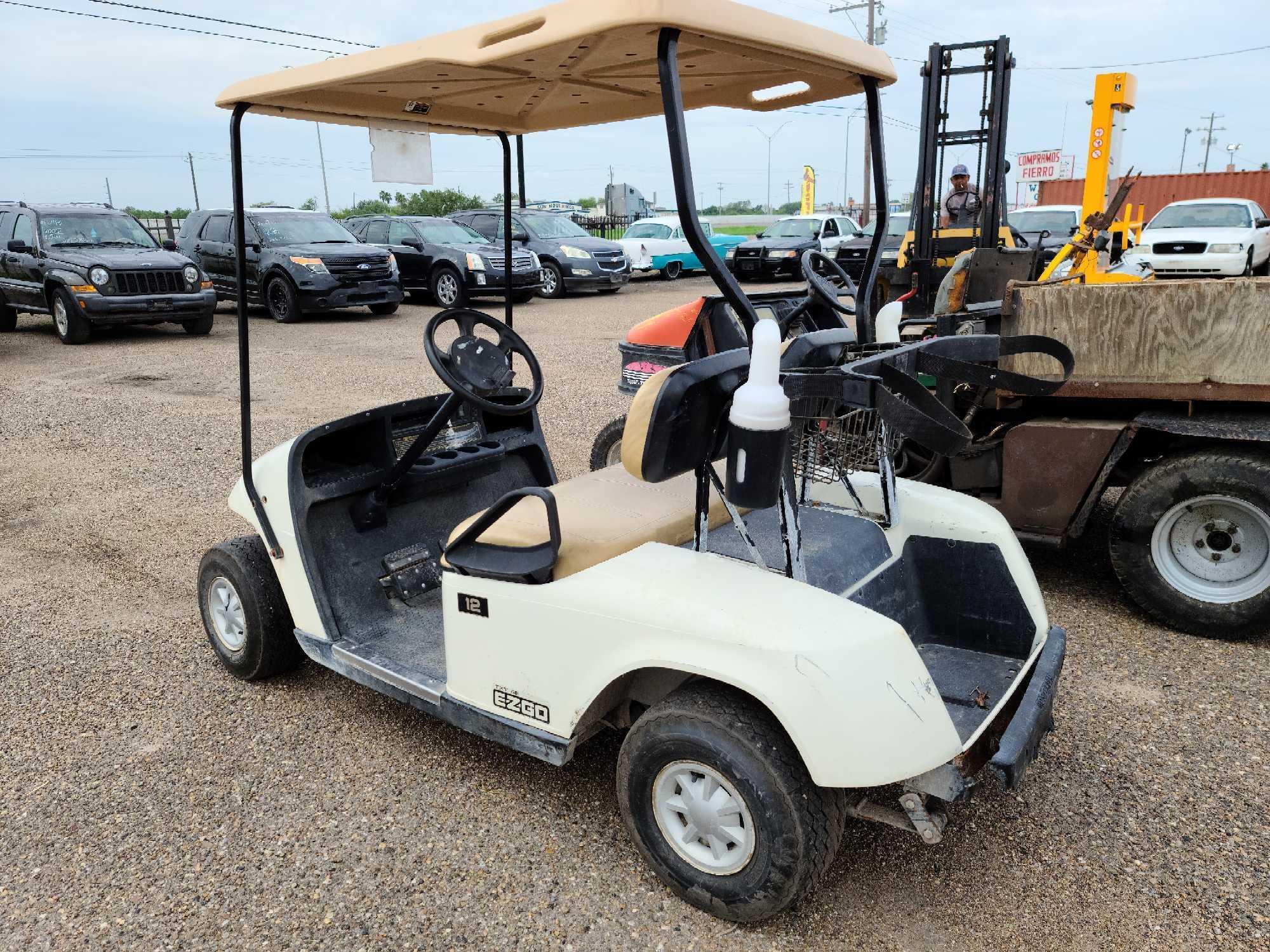 White EZGO Golf Cart