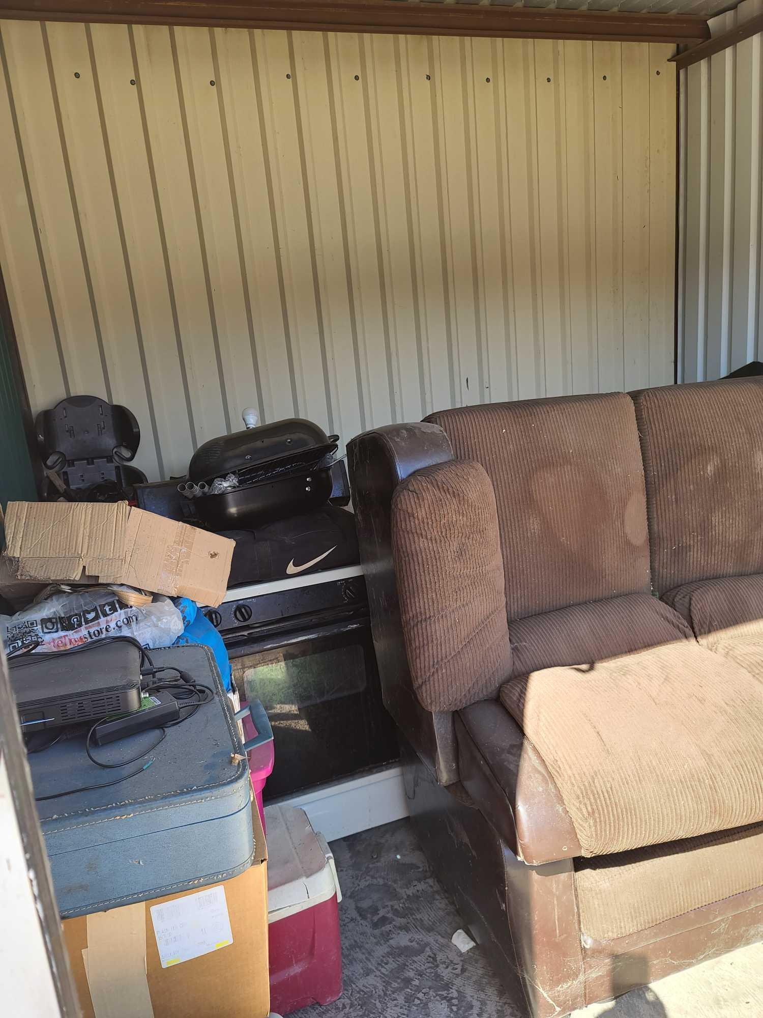 (UNIT # 52) 10x20 Couches, coolers, suitcase, air conditioner, child's car seat, grill