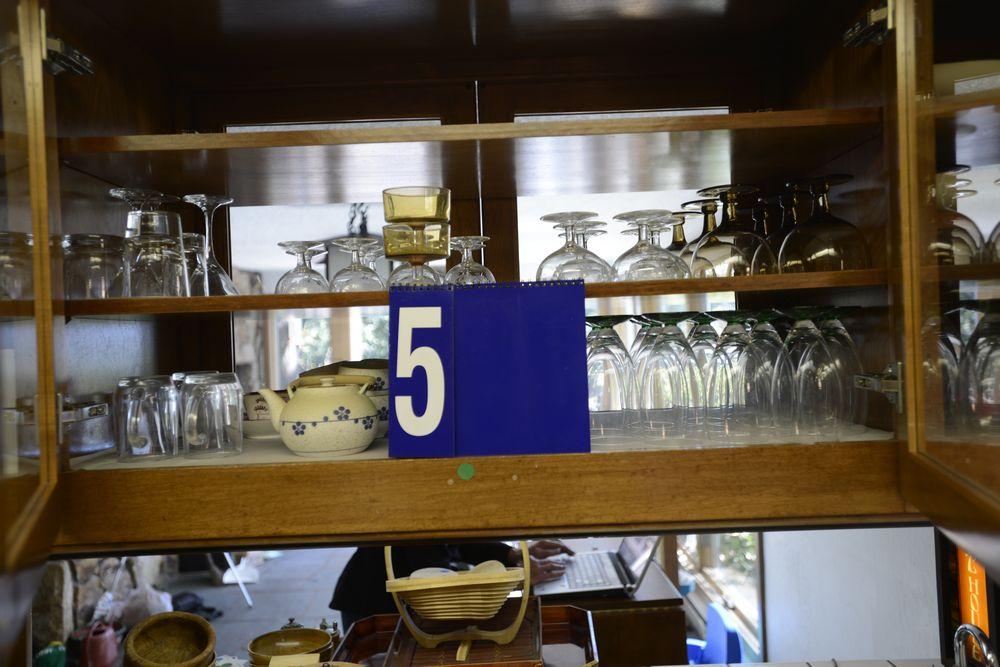 Two Shelves of Water and Wine And Beverage Glasses