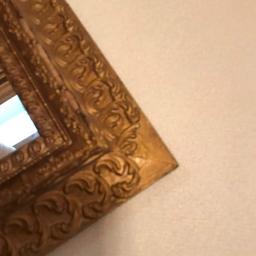 Antique Mirror with Ornately carved Gilt Wooden Frame