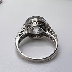 Sterling Silver Ring with Large Clear Stone & Small Stones on Band