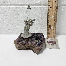 Pewter Hand Holding Crystal Sword on Amethyst