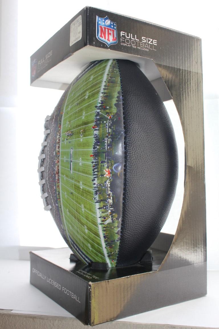 Lot 411- SEAHAWKS FULL SIZE FOOTBALL WITH DISPLAY TEE