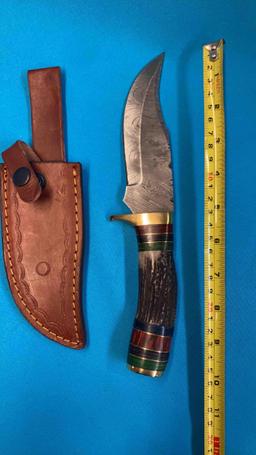 Handmade Damascus steel knives with either custom wood, bone, or resin handles