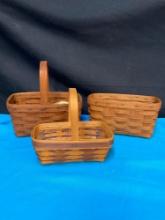 3 Longaberger baskets one with liner and an extra liner