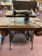 antique singer sewing machine cabinet with red eye machine