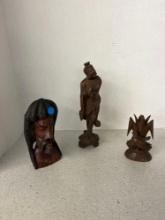 Antique wood carving includes Asian statue Jamaican bust and wood carved bird