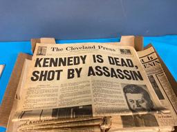 JFK book and newspapers about assassination