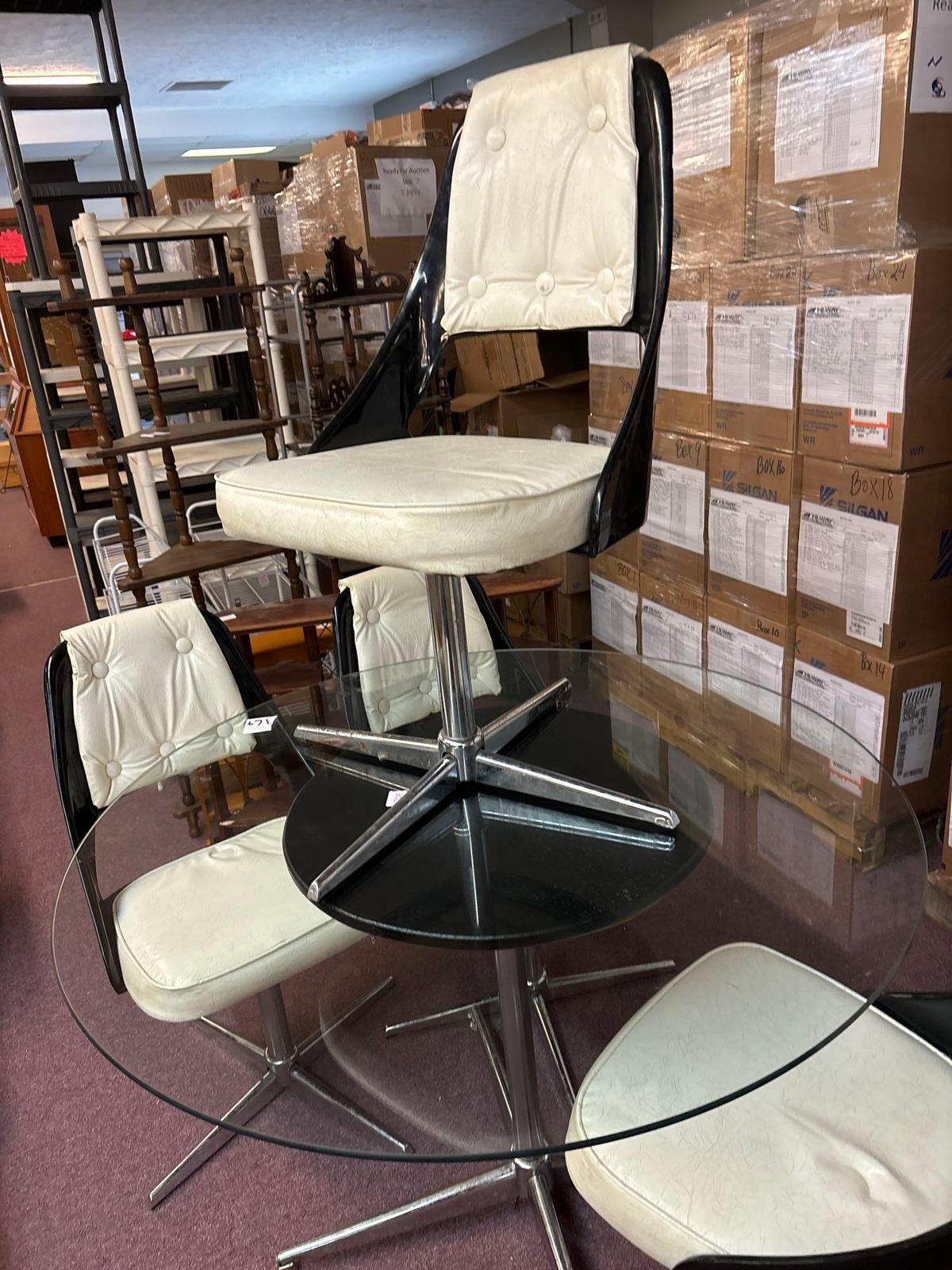 mid century glass top table with four matching chairs