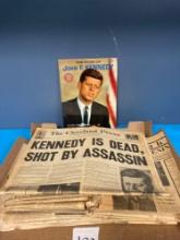 JFK book and newspapers about assassination