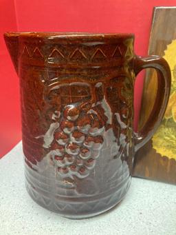 Pair of glazed pottery pitchers and a vintage foxes decoupage picture on wood