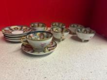 Nippon handpainted beaded cup and saucer set