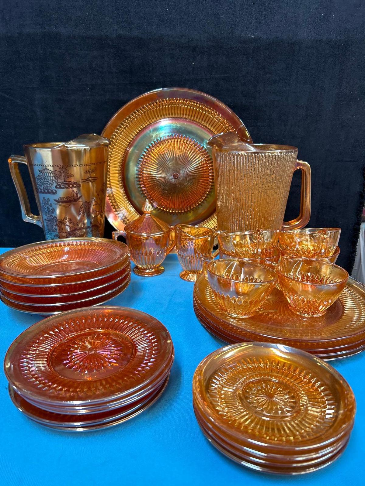 29 pieces of iridescent, carnival glass, including 2 pitchers