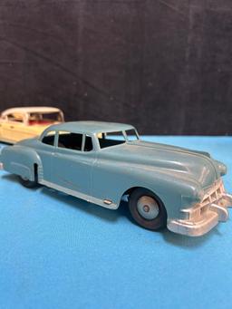 4 vintage friction toy cars Cadillac Buick jaguar