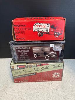 3 diecast vehicles in boxes