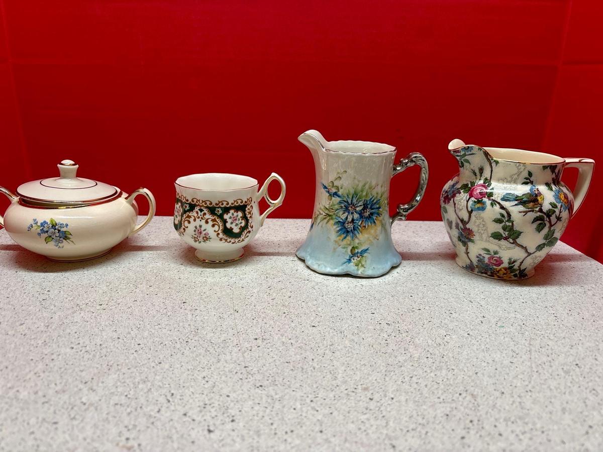 many pieces of Porcelain cups pots etc.