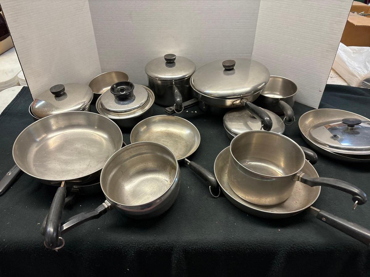 large quantity of stainless steel cookware