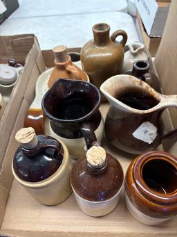 two flats of stoneware jugs