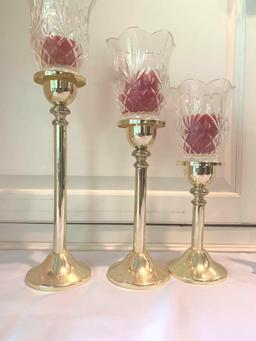 2 sets of candleholders