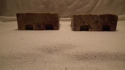 Pr. soapstone bookends, bird w/ flowers cascading from a vase 4 15/16”x6 1/8” x 1 15/16”