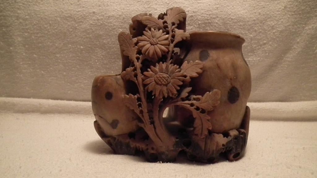 Soapstone double vase, carved vines & flowers w/ black circles on vases