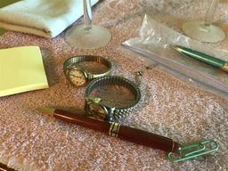Items on dresser lot inc. pens, glass, watches