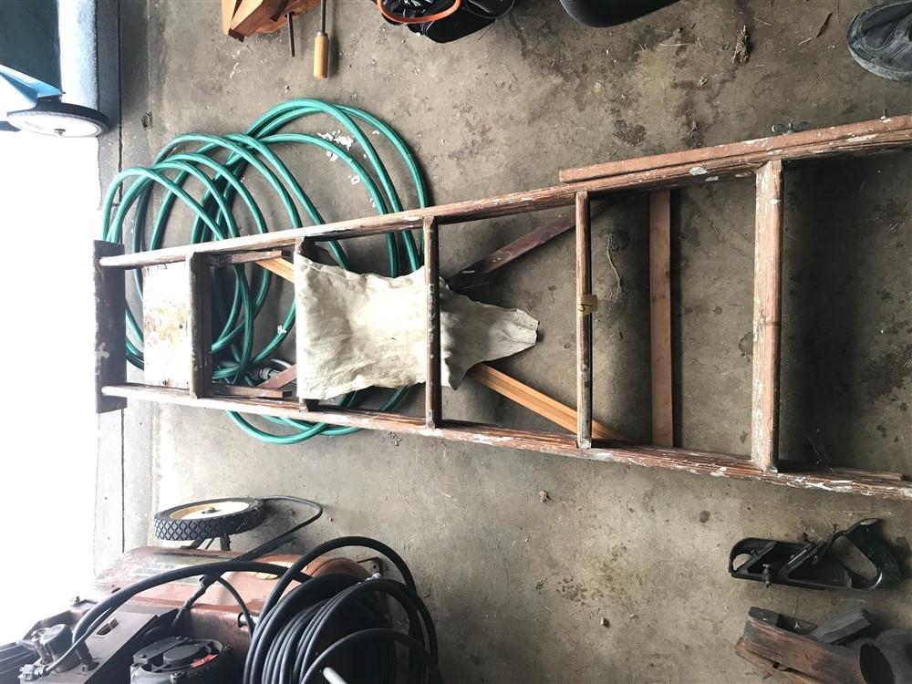 Old Wooden Ladder and Hose