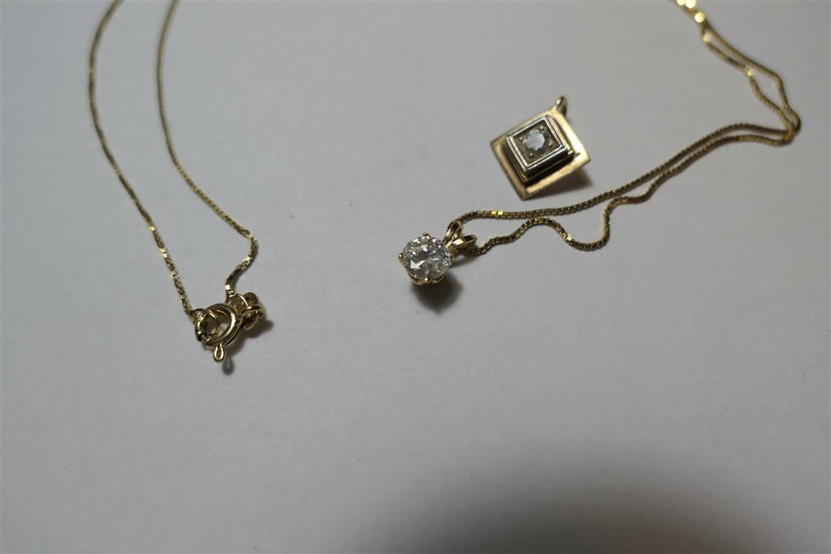 2 14k pendants set with diamonds