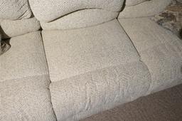 Nicer upholstered couch with pop out foot rests