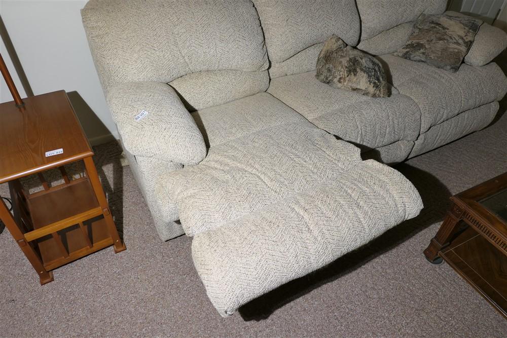 Nicer upholstered couch with pop out foot rests