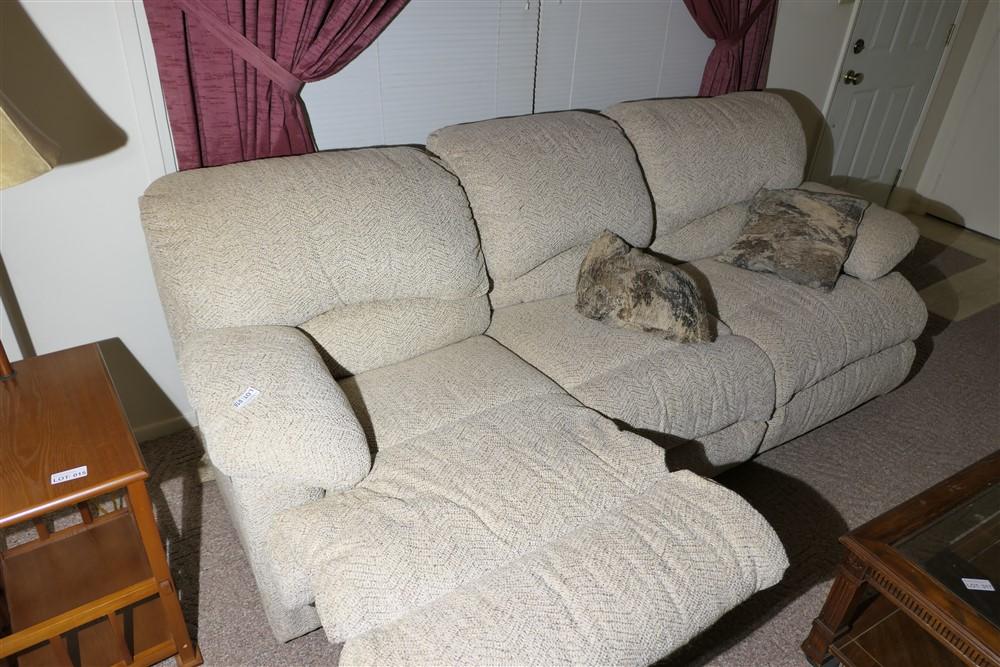 Nicer upholstered couch with pop out foot rests