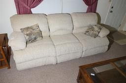 Nicer upholstered couch with pop out foot rests