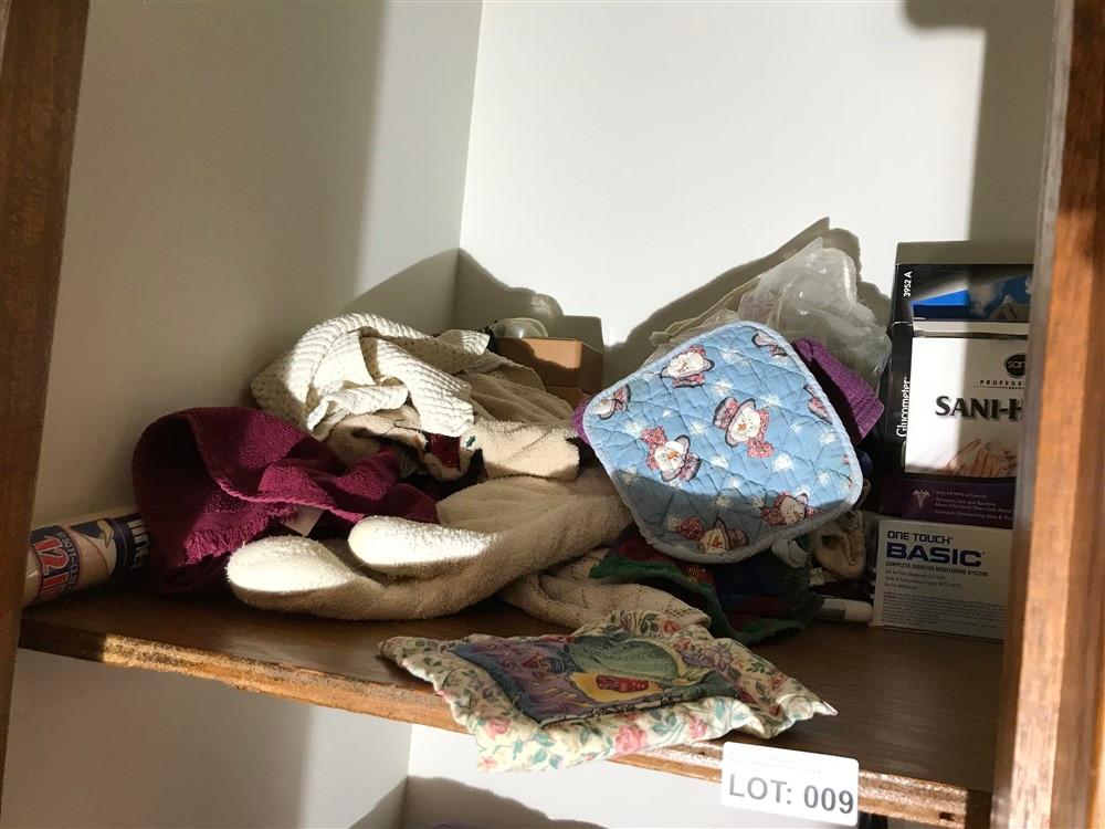 Contents of hall closet, towels, medical