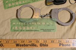 Vintage police lot - handcuffs, ticket stencil, etc