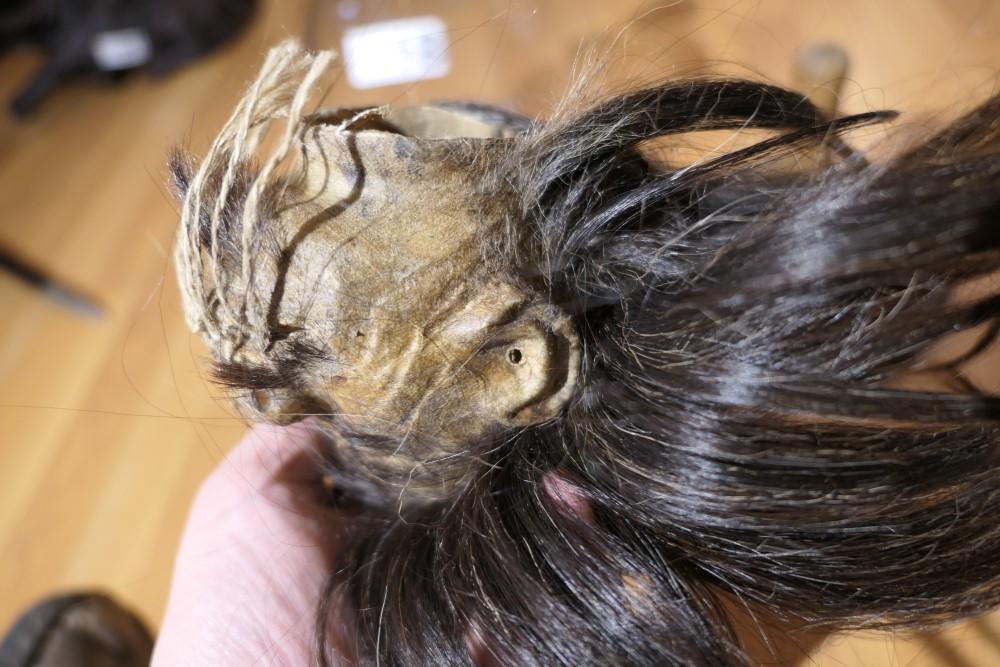 Unusual old Shrunken Head under Glass