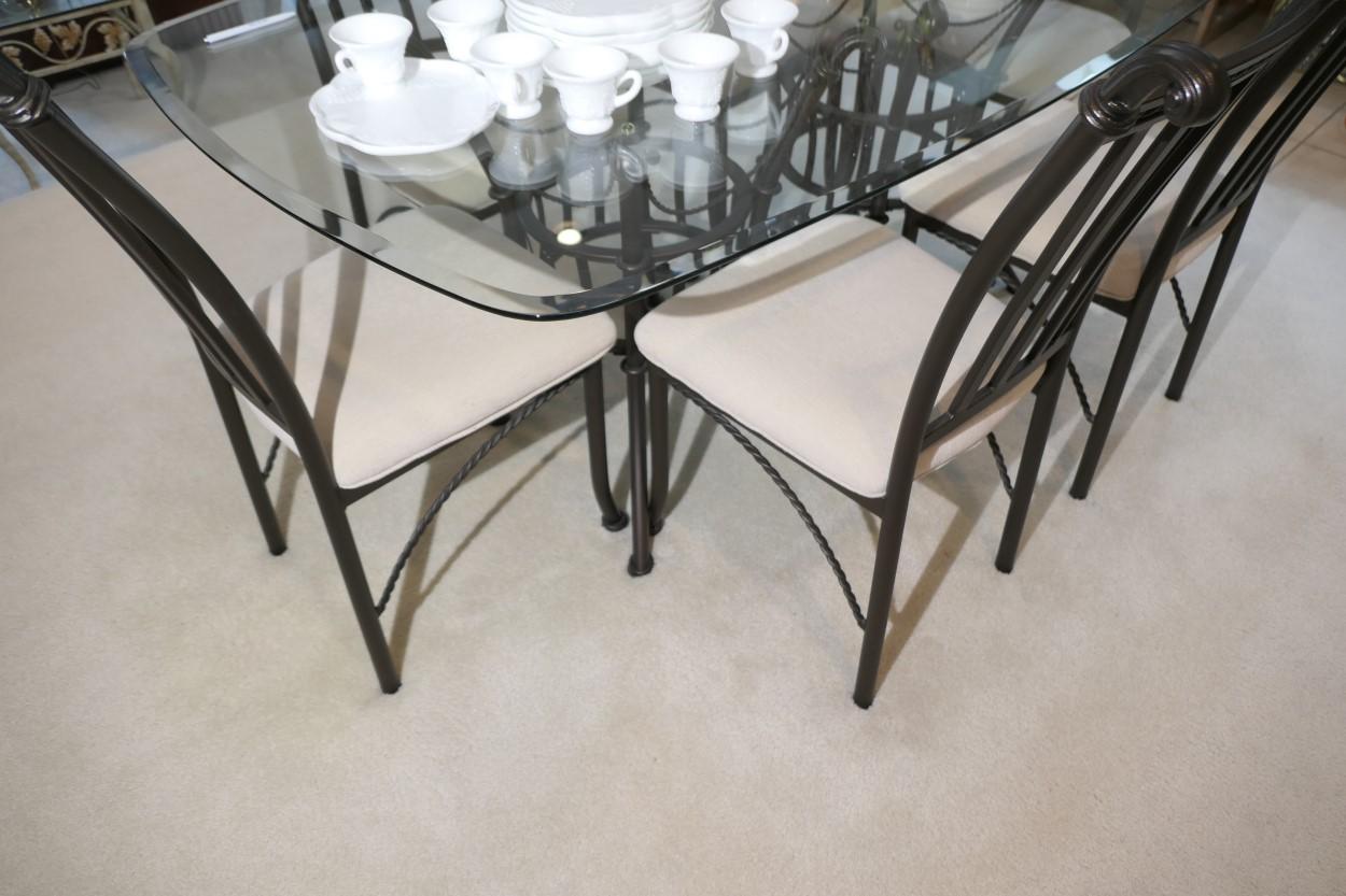 Glass topped table and set of six dining chairs