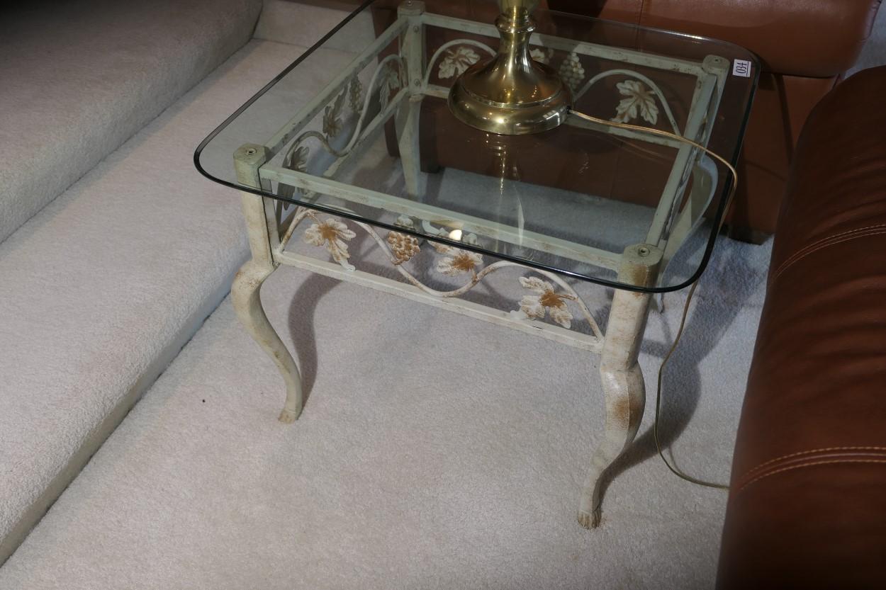 Glass topped lamp table with metal floral base