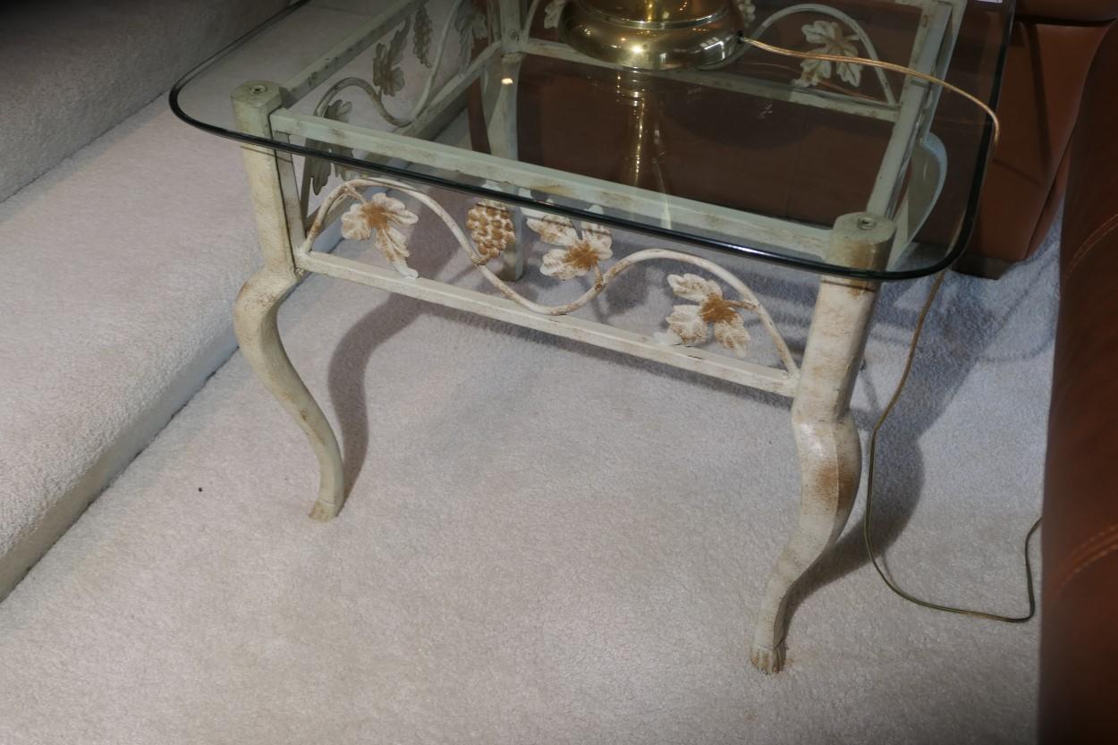 Glass topped lamp table with metal floral base