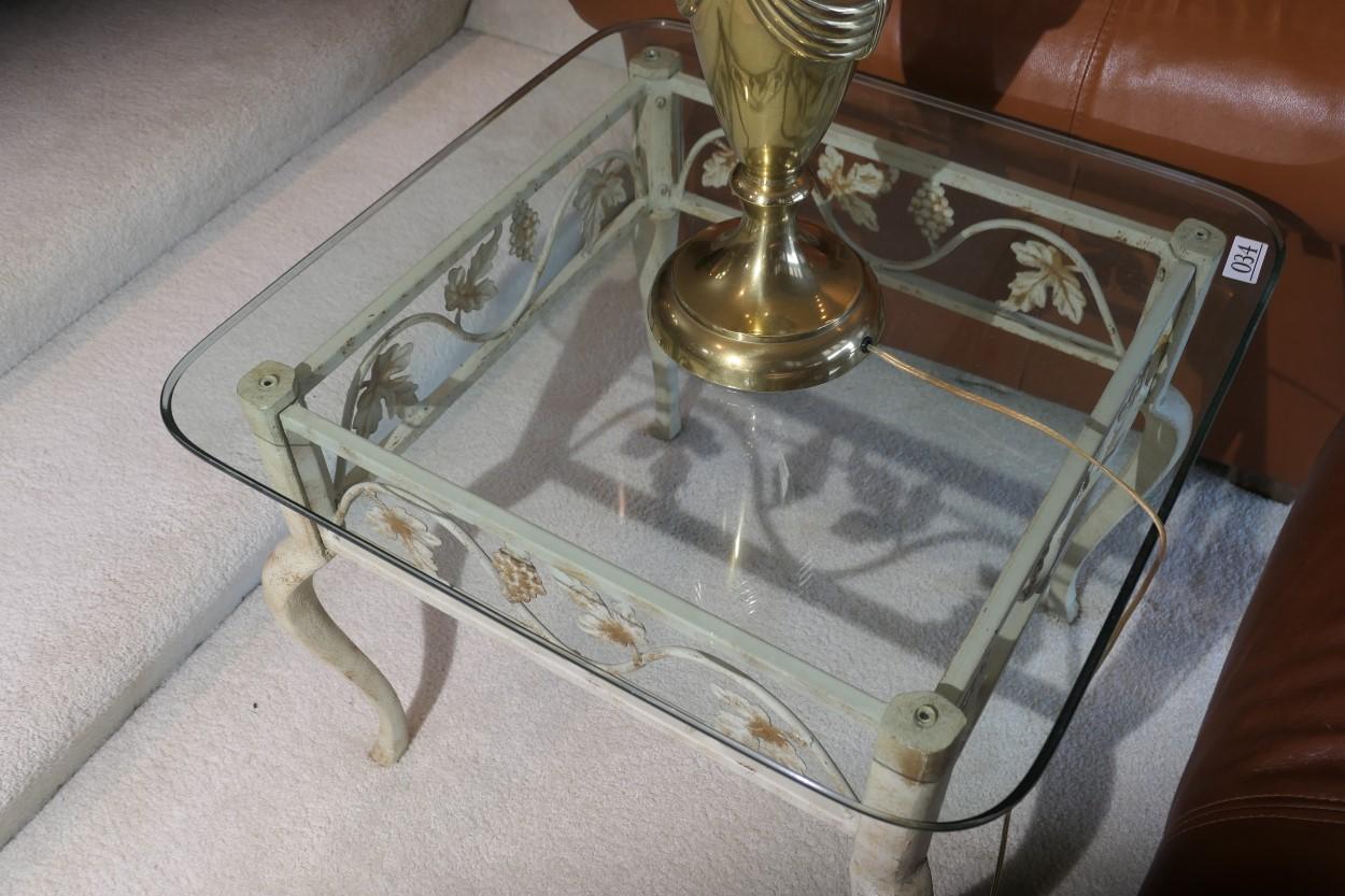 Glass topped lamp table with metal floral base