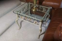 Glass topped lamp table with metal floral base