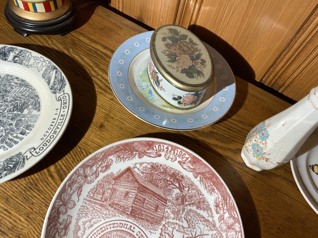 Collector plates, lamp etc on dresser