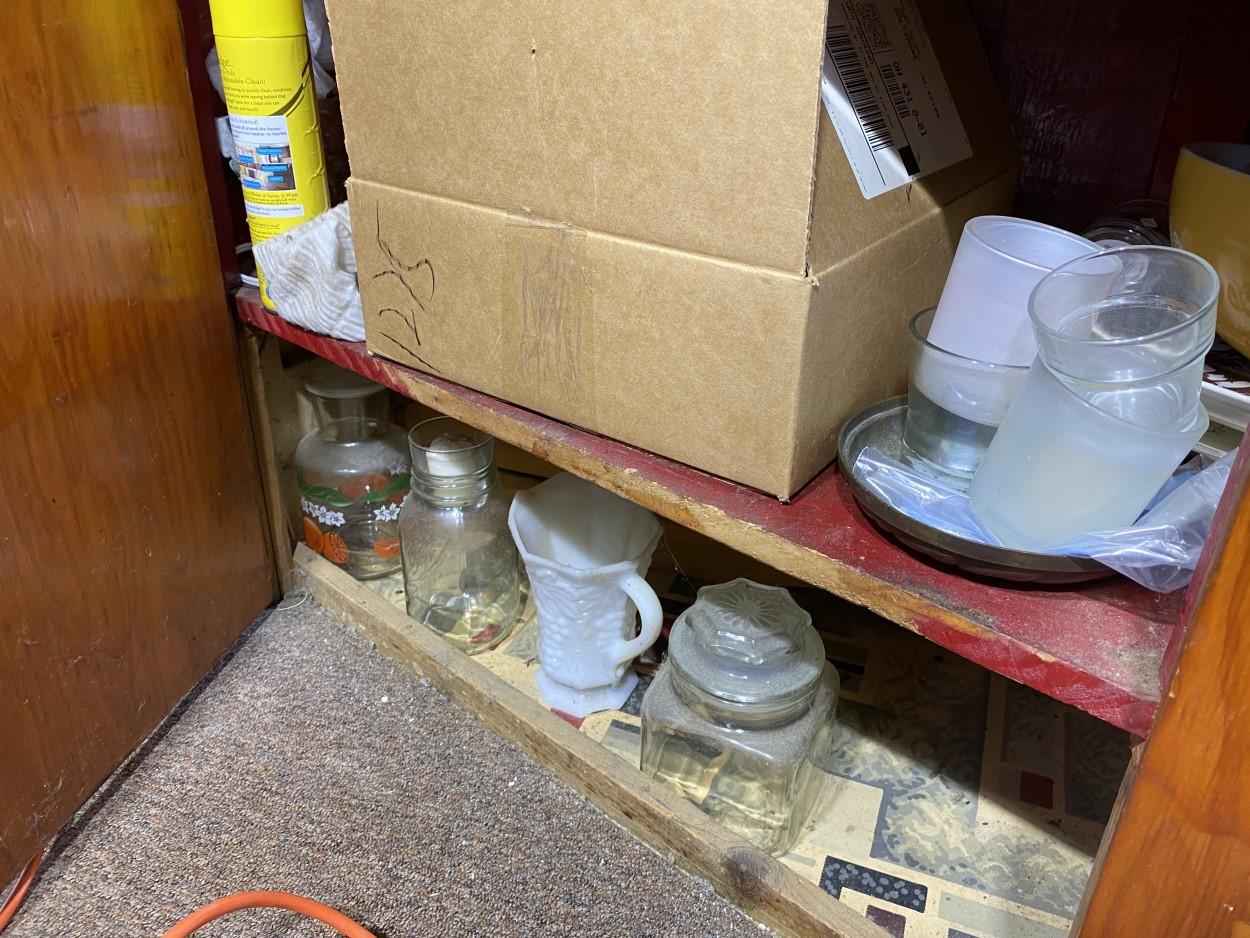 Contents of kitchen cabinets including Pyrex