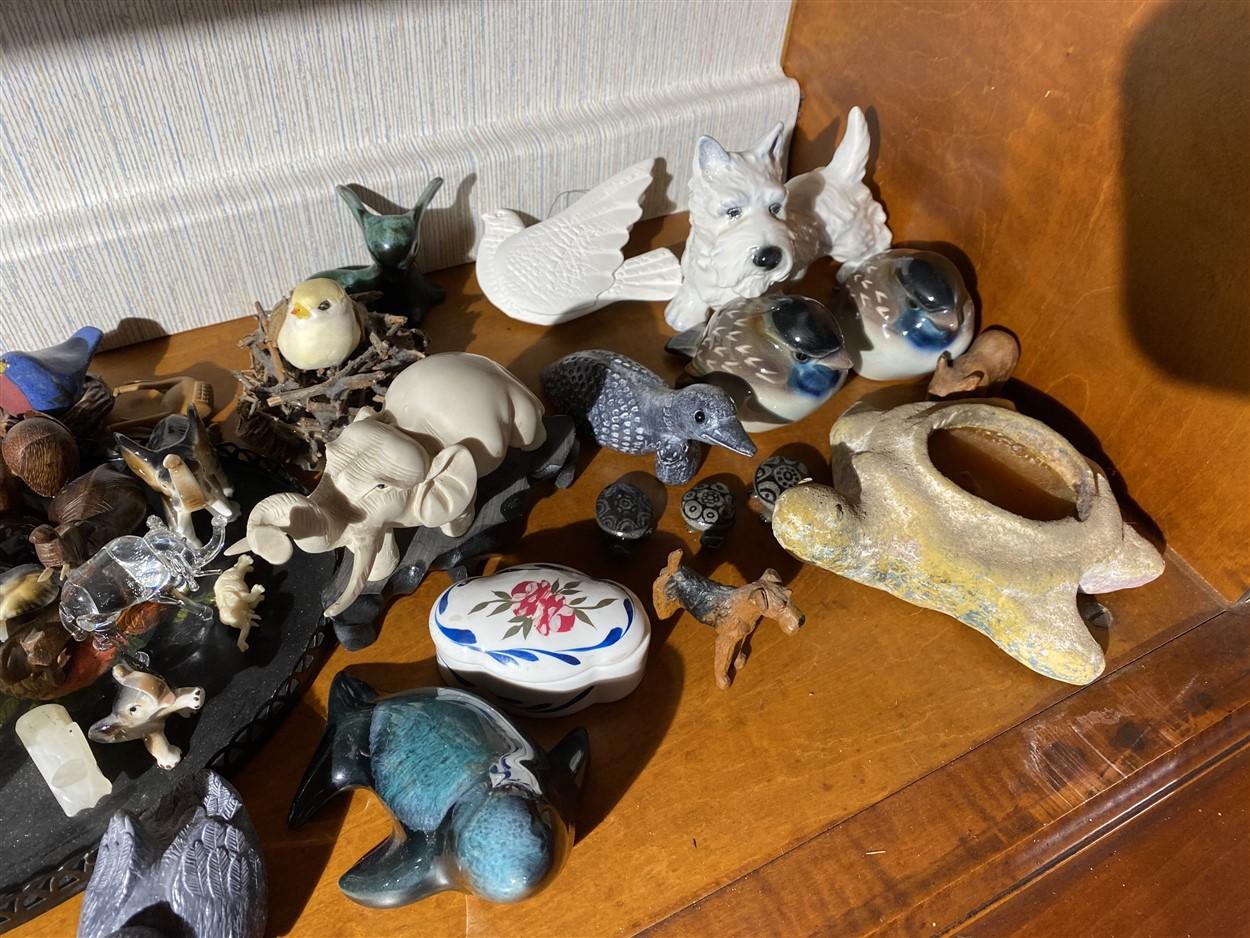 Shelf lot of carvings, figurines inc. Native Canadian made, Goebel terrier