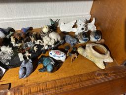 Shelf lot of carvings, figurines inc. Native Canadian made, Goebel terrier