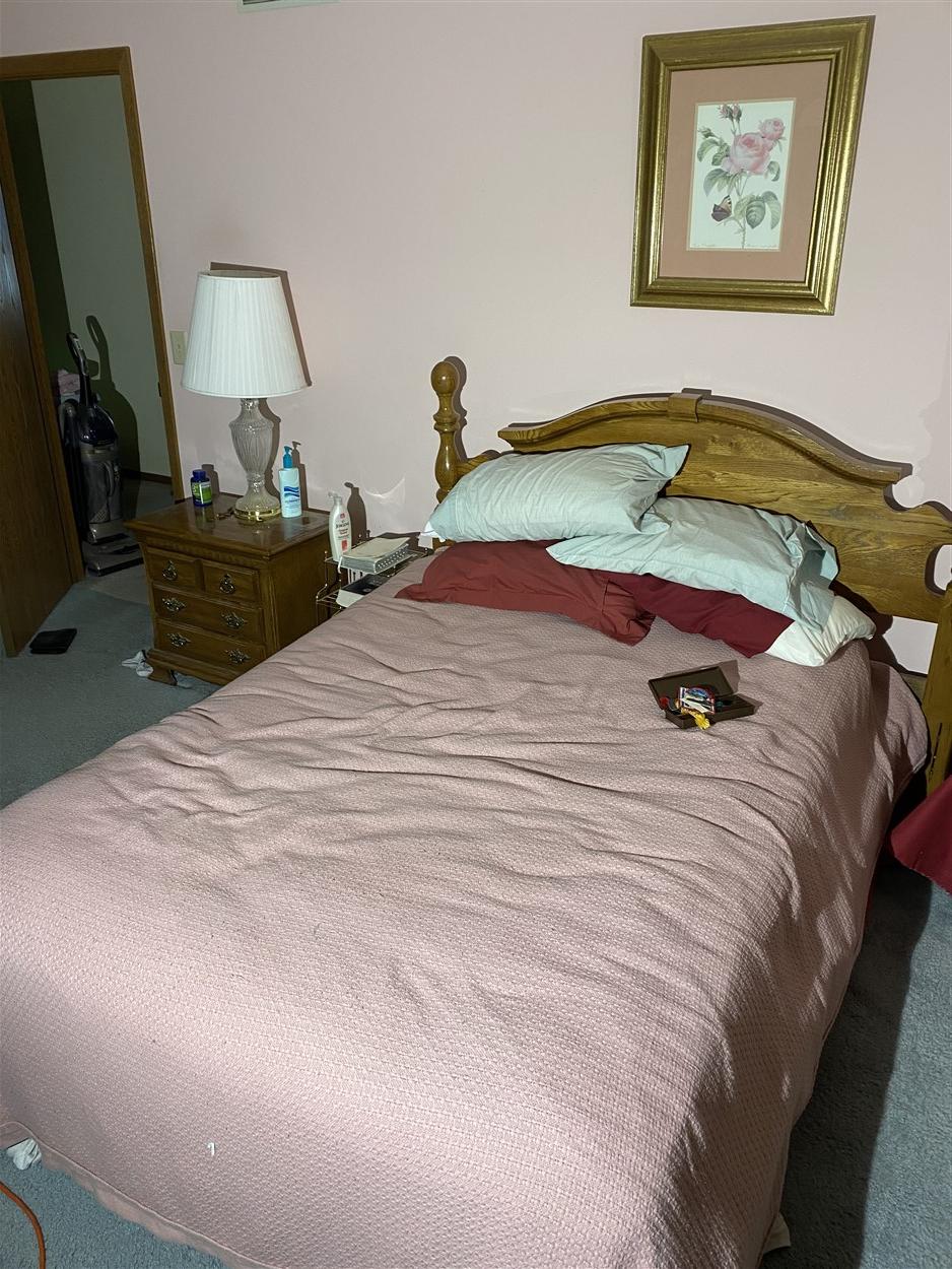 Full sized bed, picture, nightstand, lamp