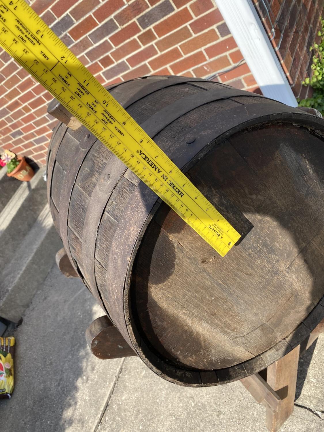 Vintage wine or whiskey barrel on stand