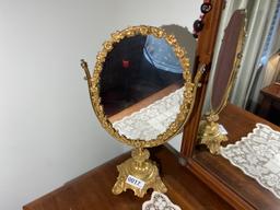Items on bureau including elaborate mirror on stand